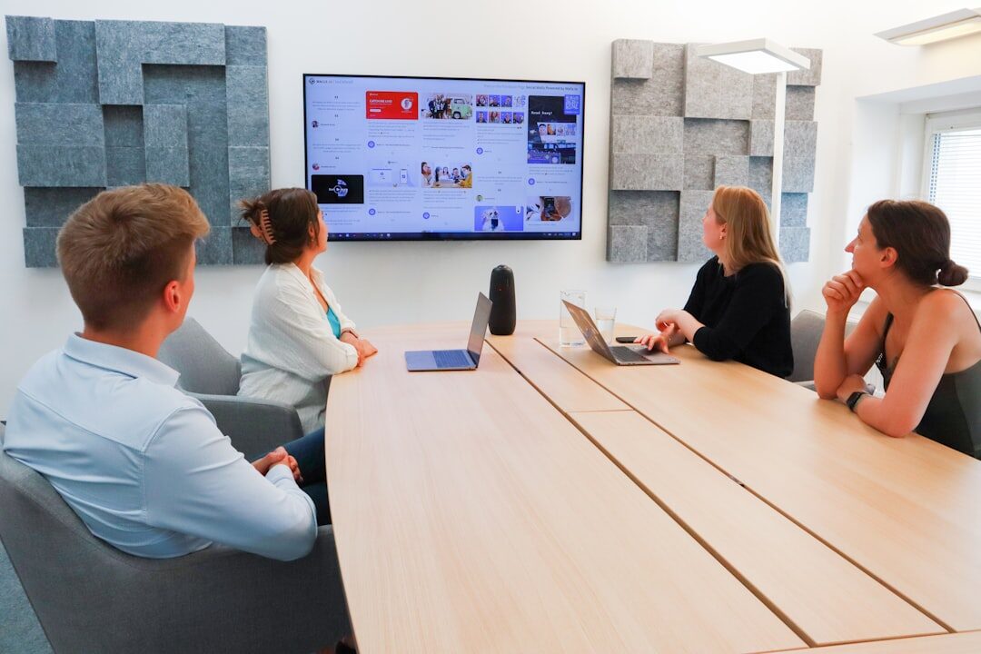 Group having an open dialogue in a bright meeting room