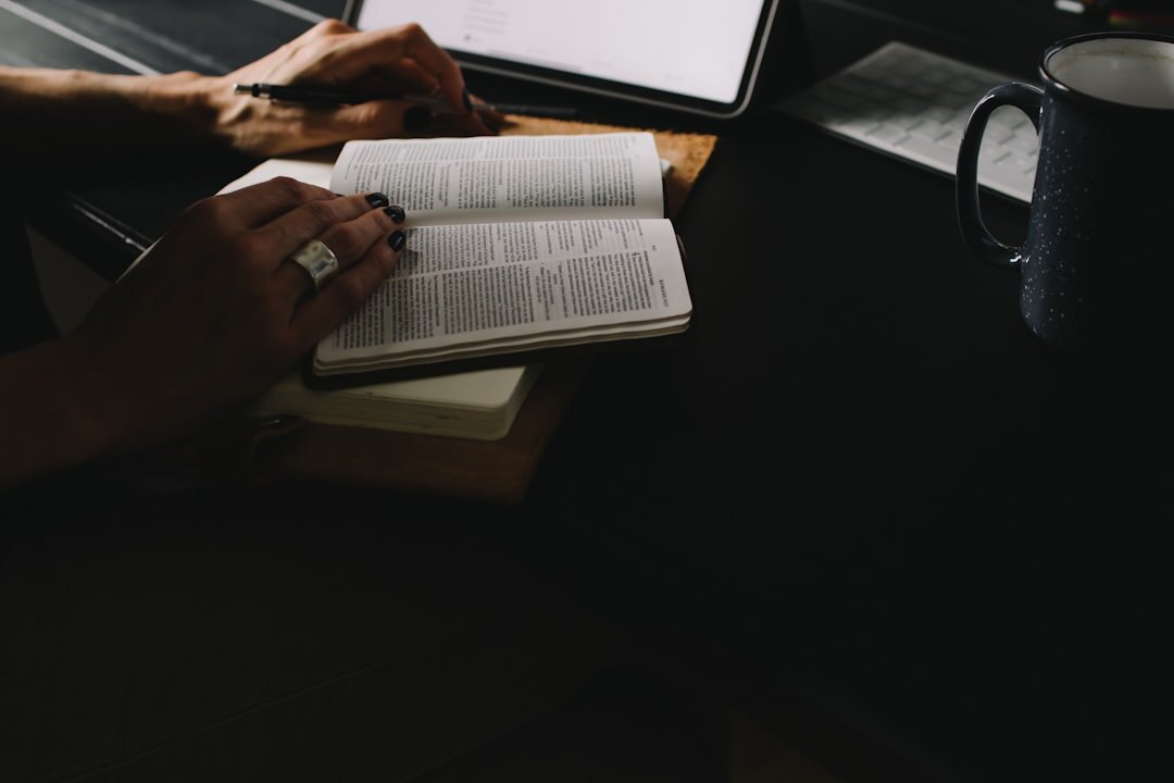 person writing in journal